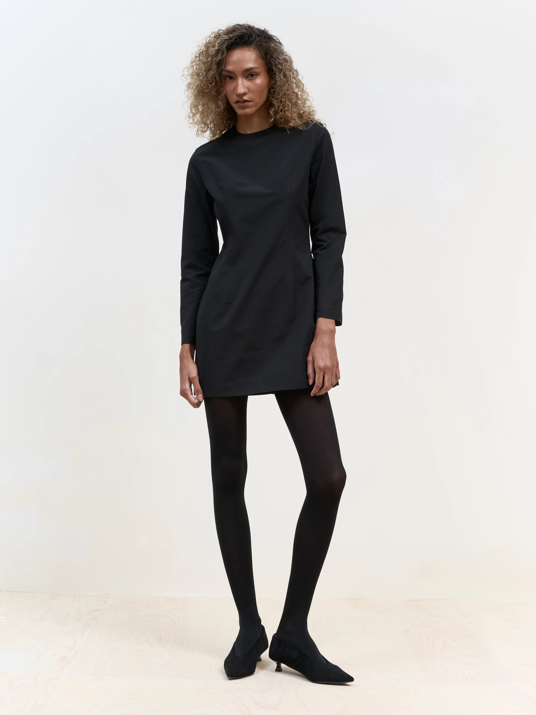 Long sleeve black mini dress in Carbon, front view