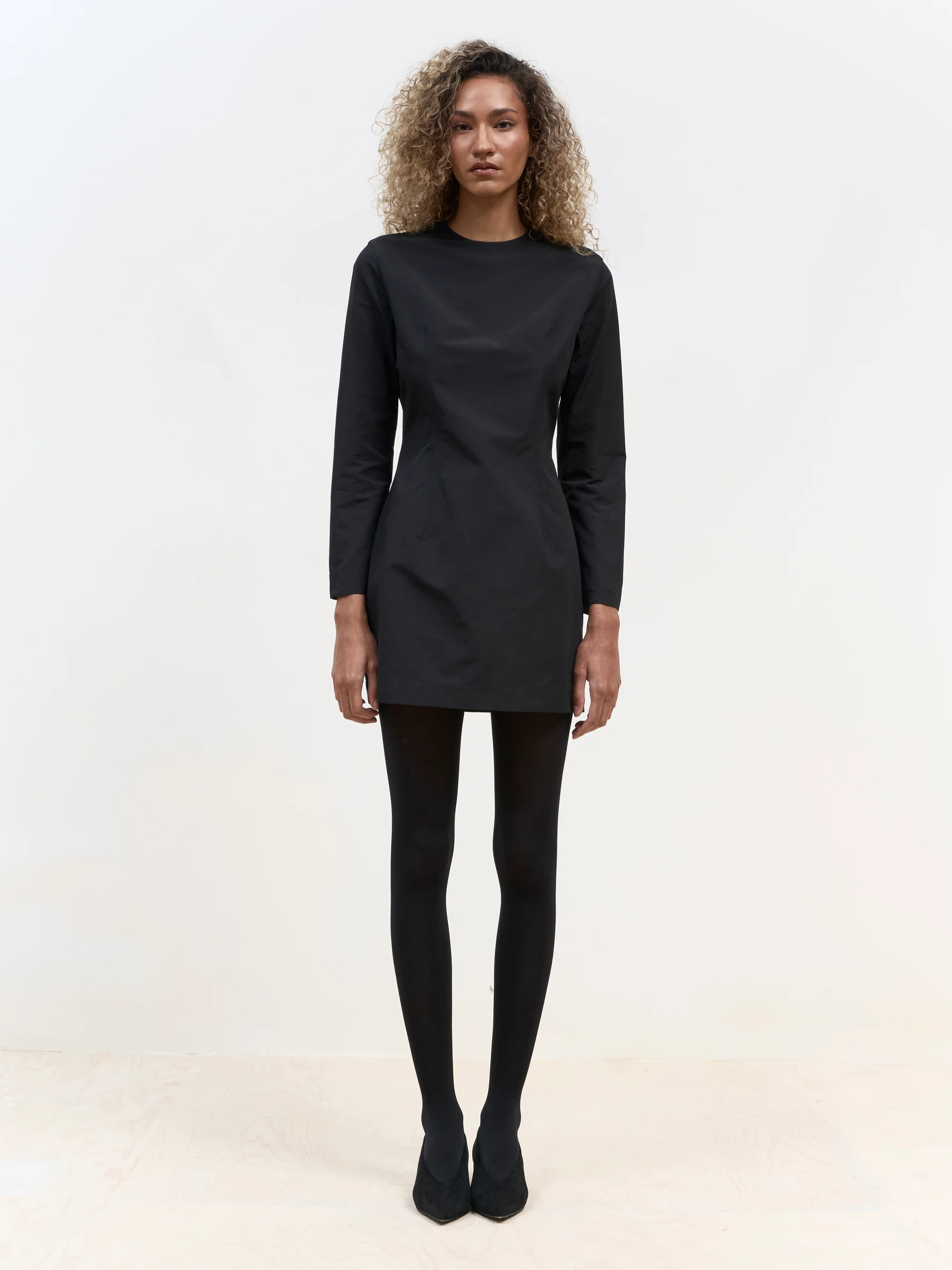 Long sleeve black mini dress in Carbon, front view