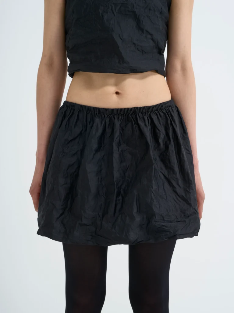 Black bubble skirt in Carbon crease, front view