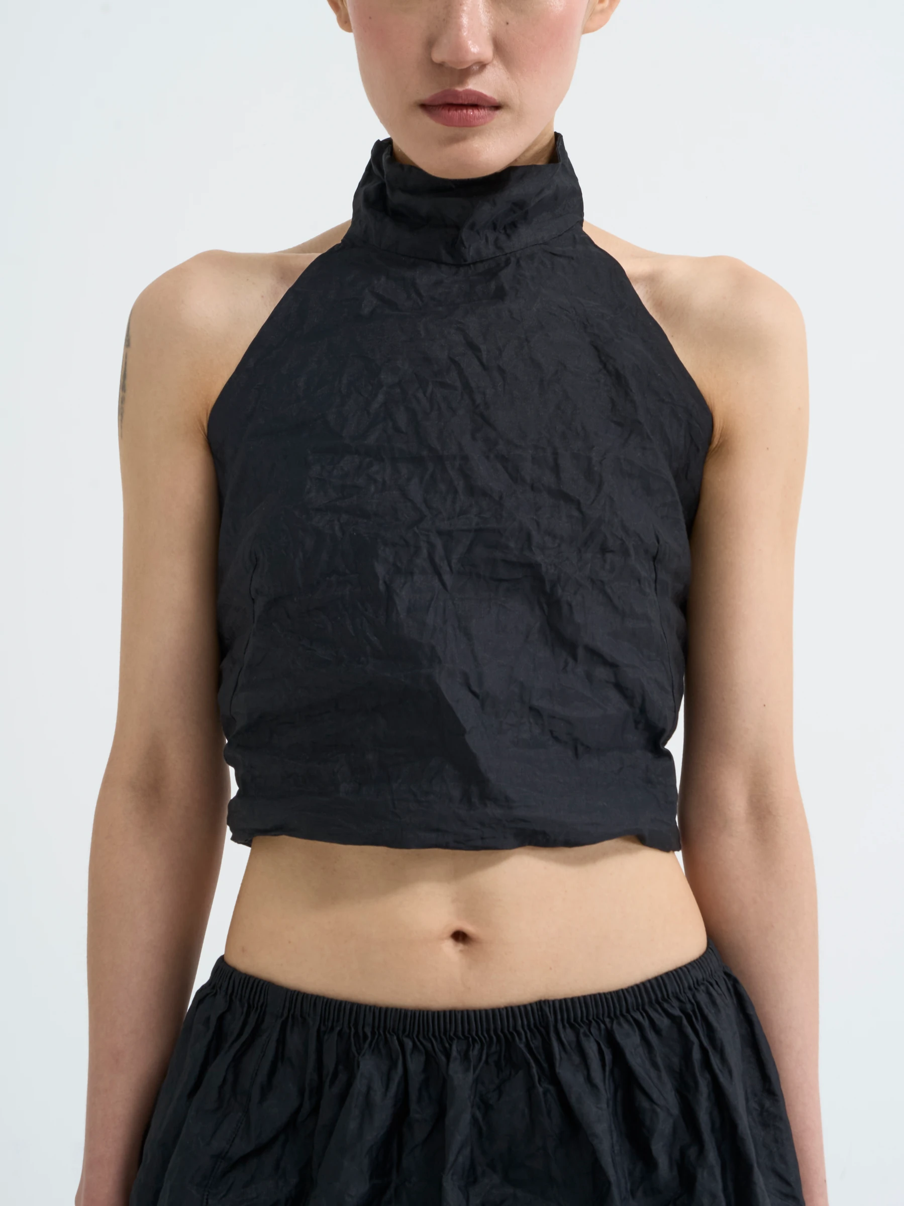 Black halter top in Carbon crease, front view