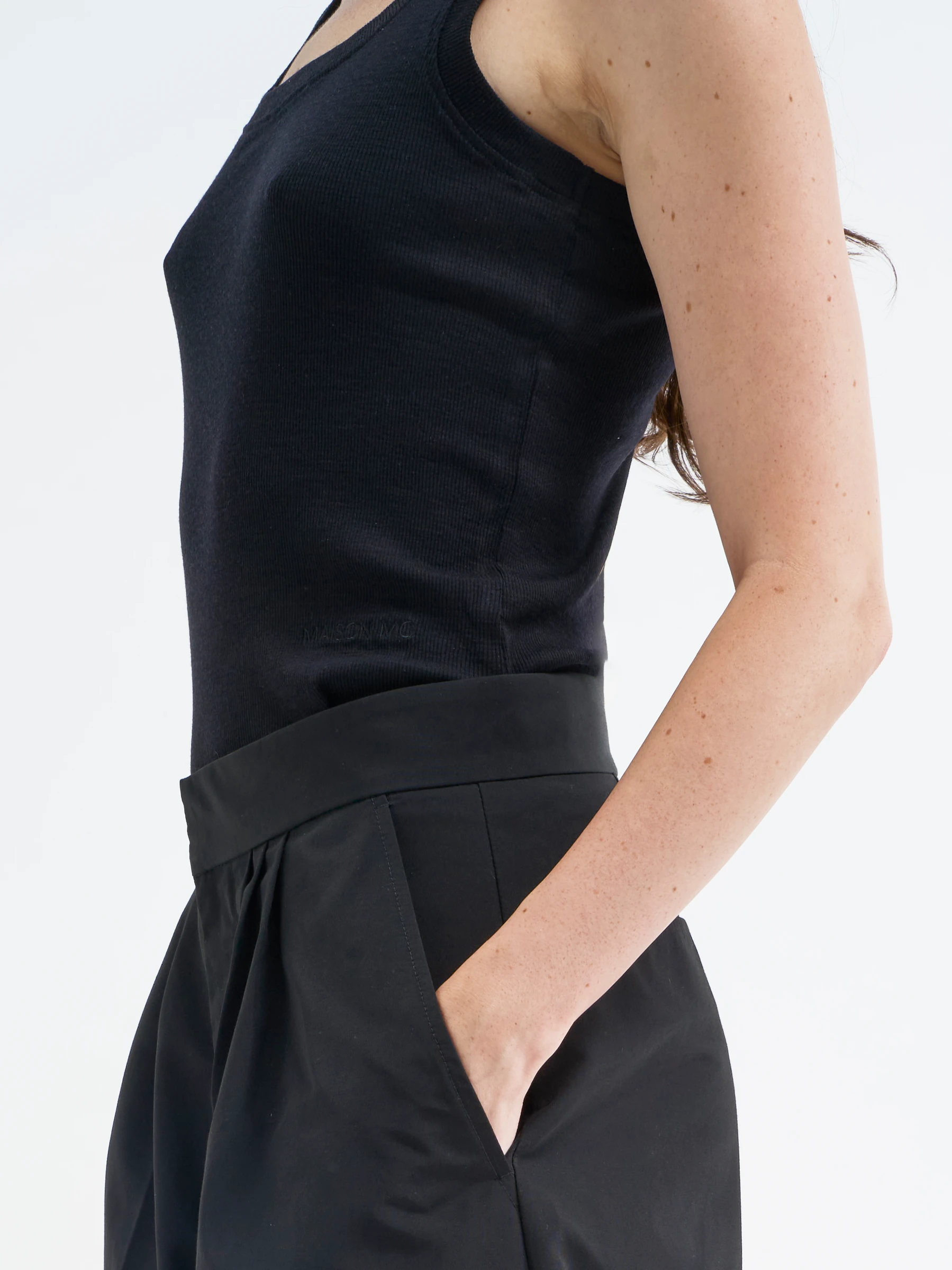 Black fitted tank top in Gorgonian Black, side view