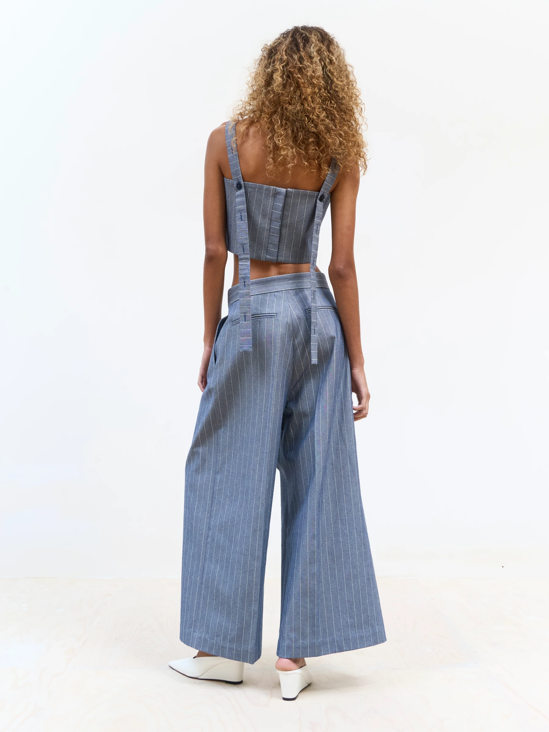 Blue pinstripe pants in Faded Ink, back view