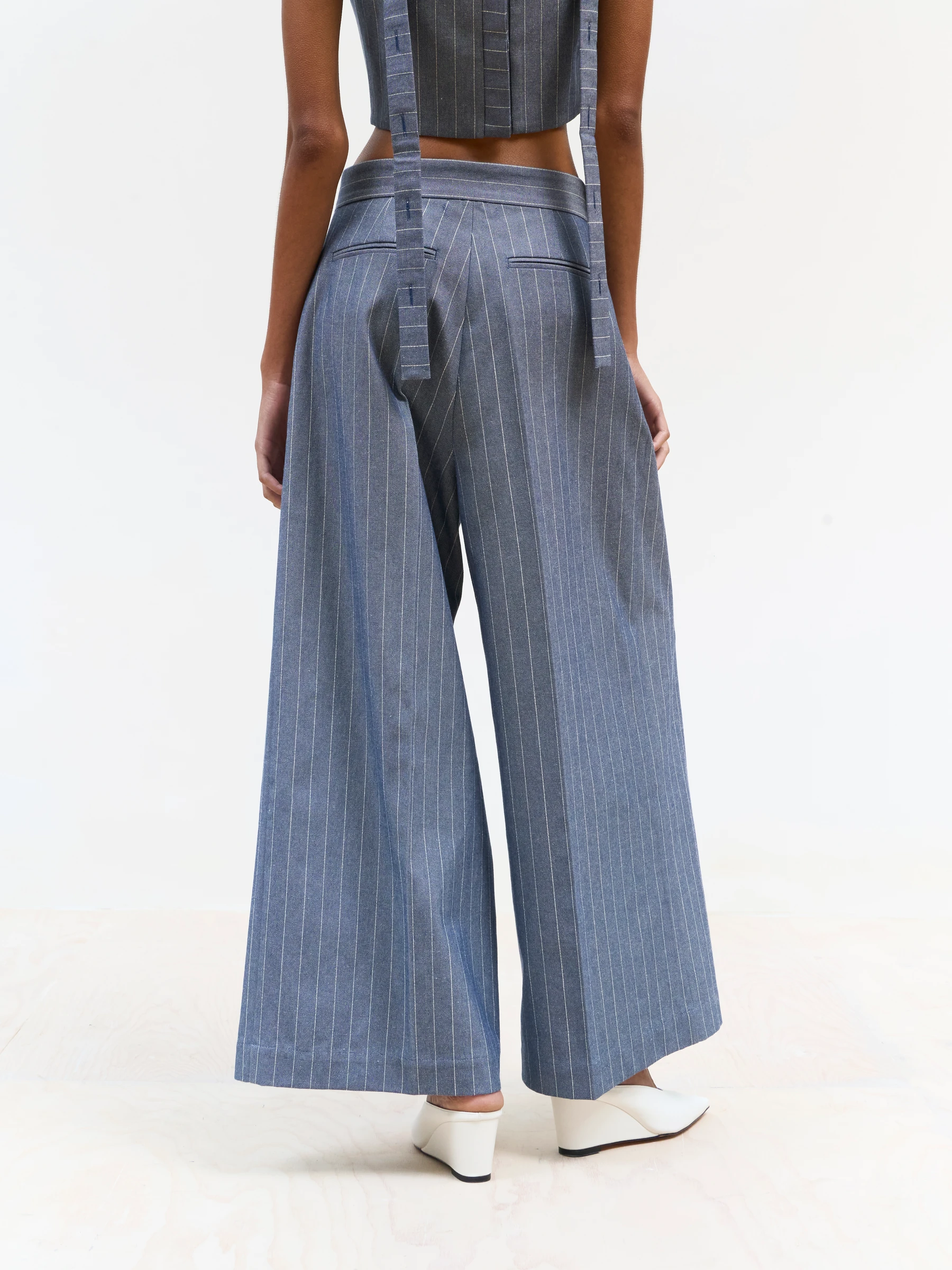 Blue pinstripe pants in Faded Ink, back view