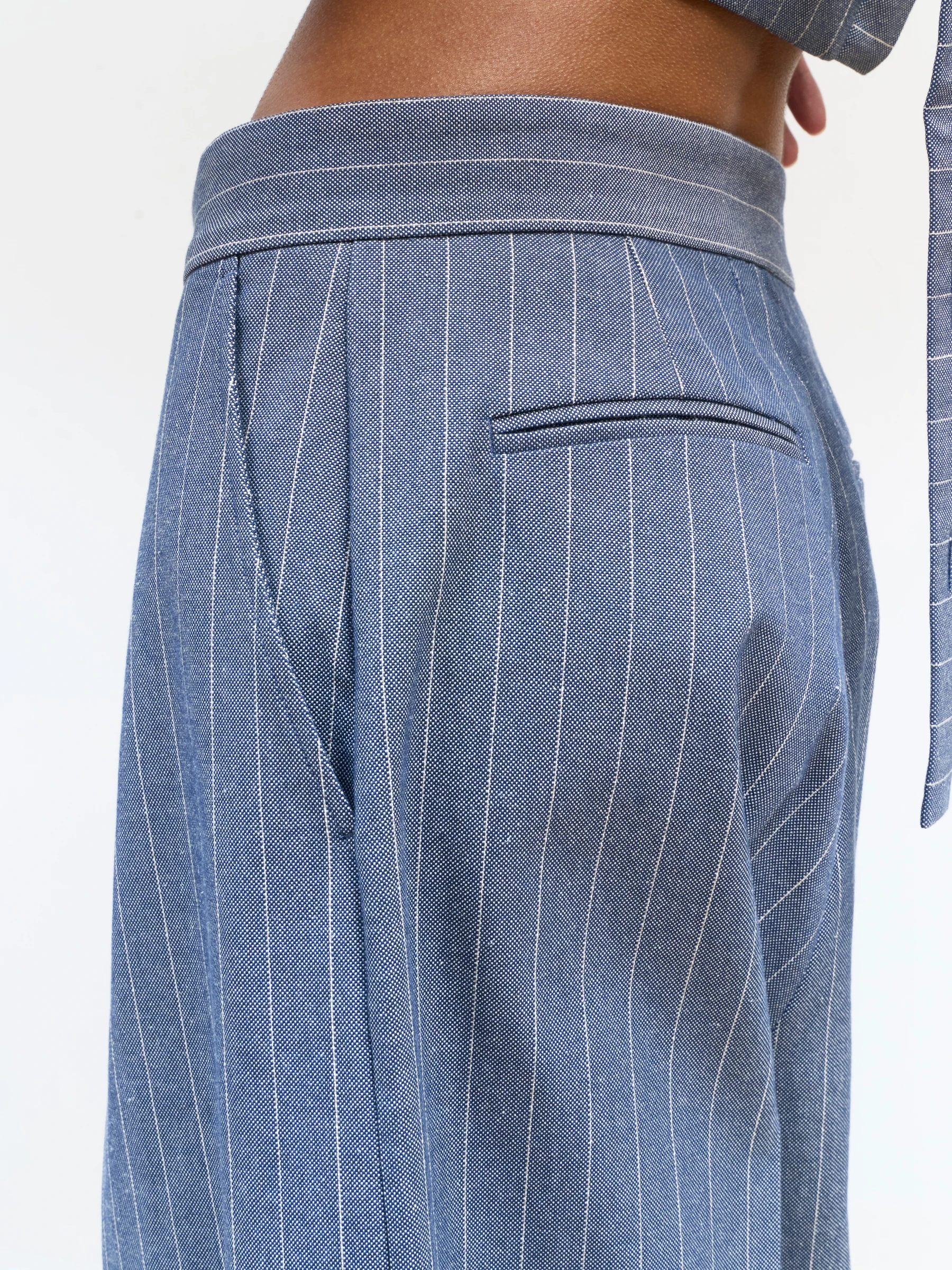 Blue pinstripe pants in Faded Ink, back view