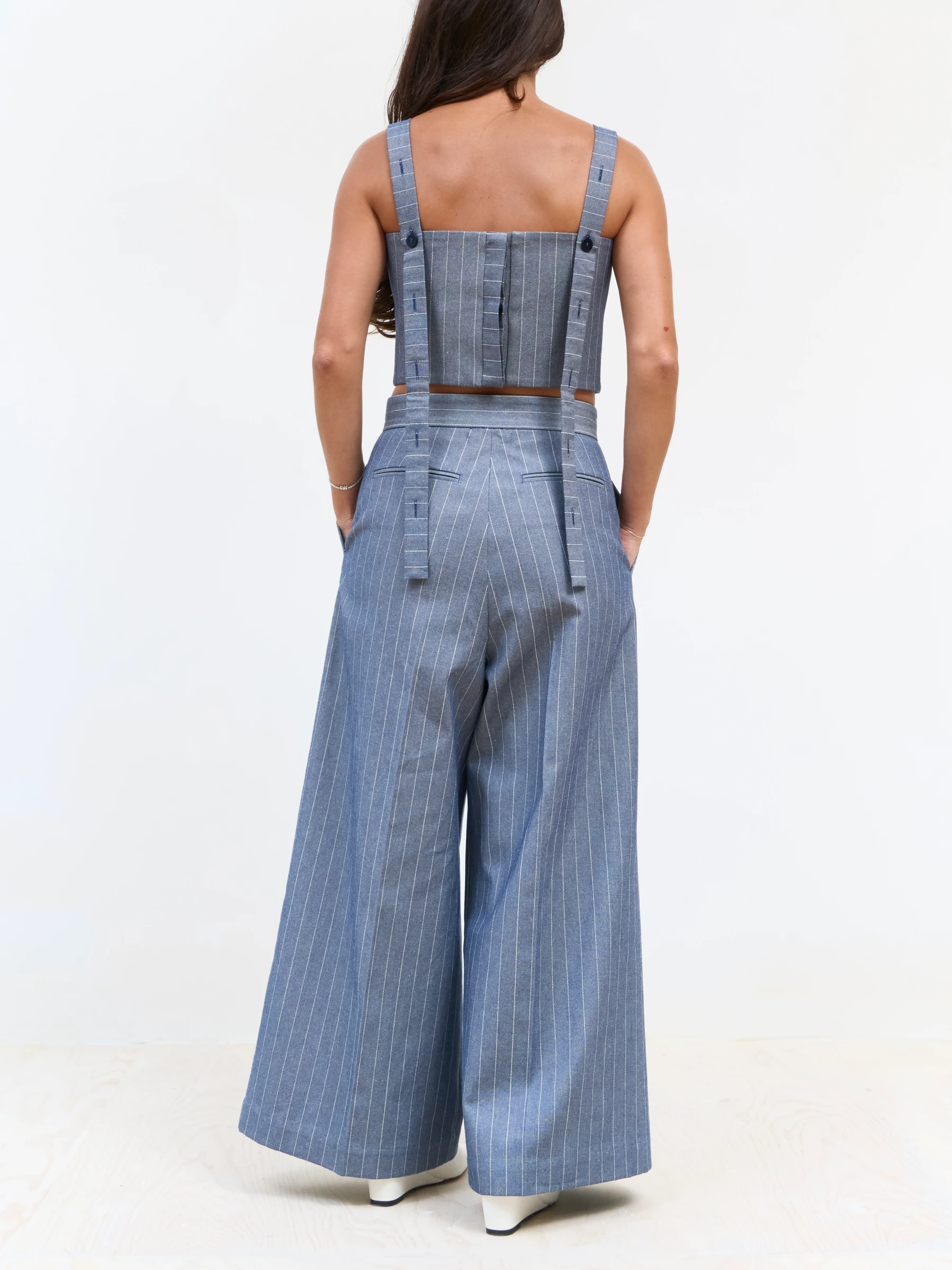 Blue pinstripe pants in Faded Ink, back view