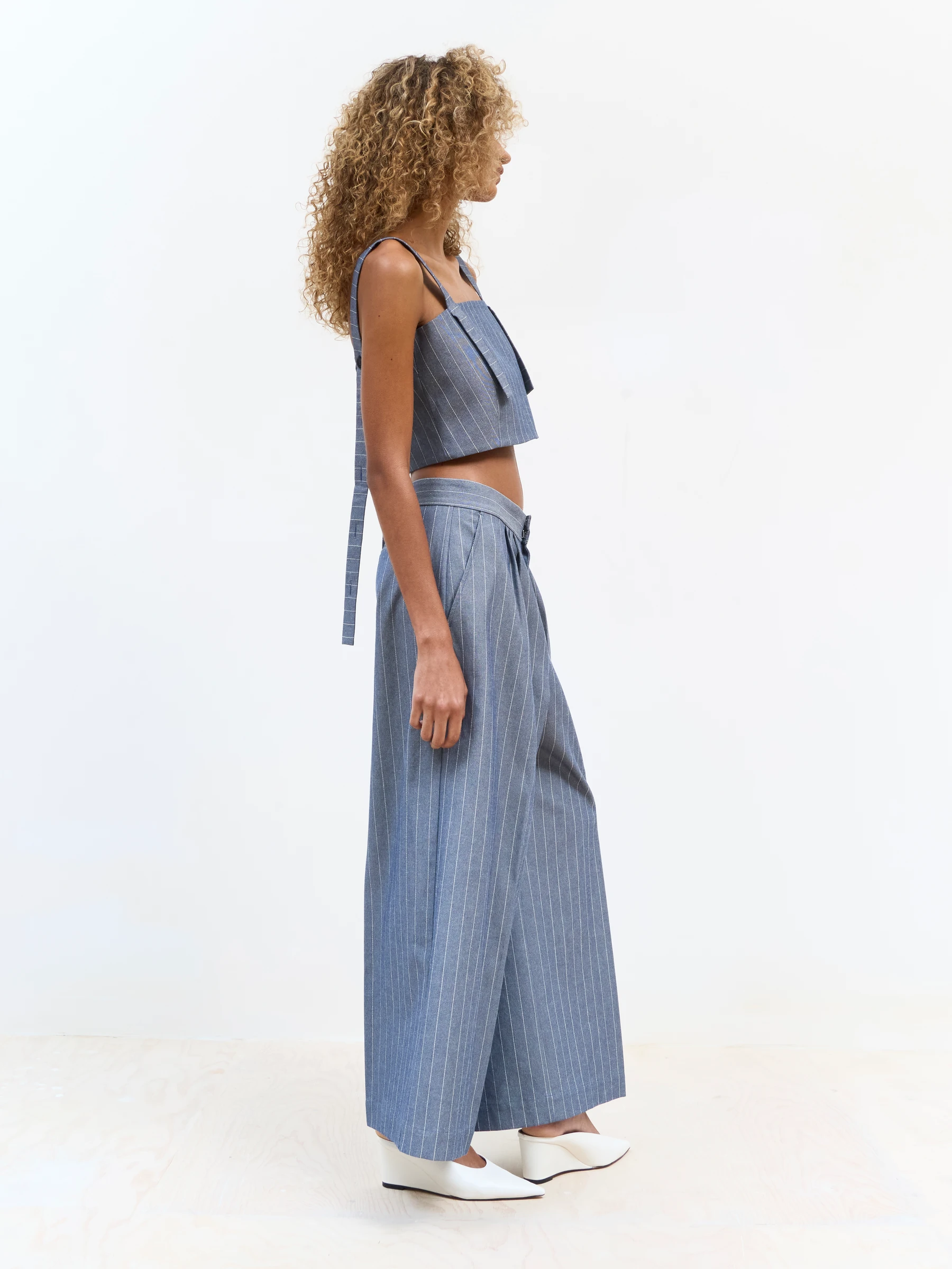 Blue pinstripe pants in Faded Ink, side view