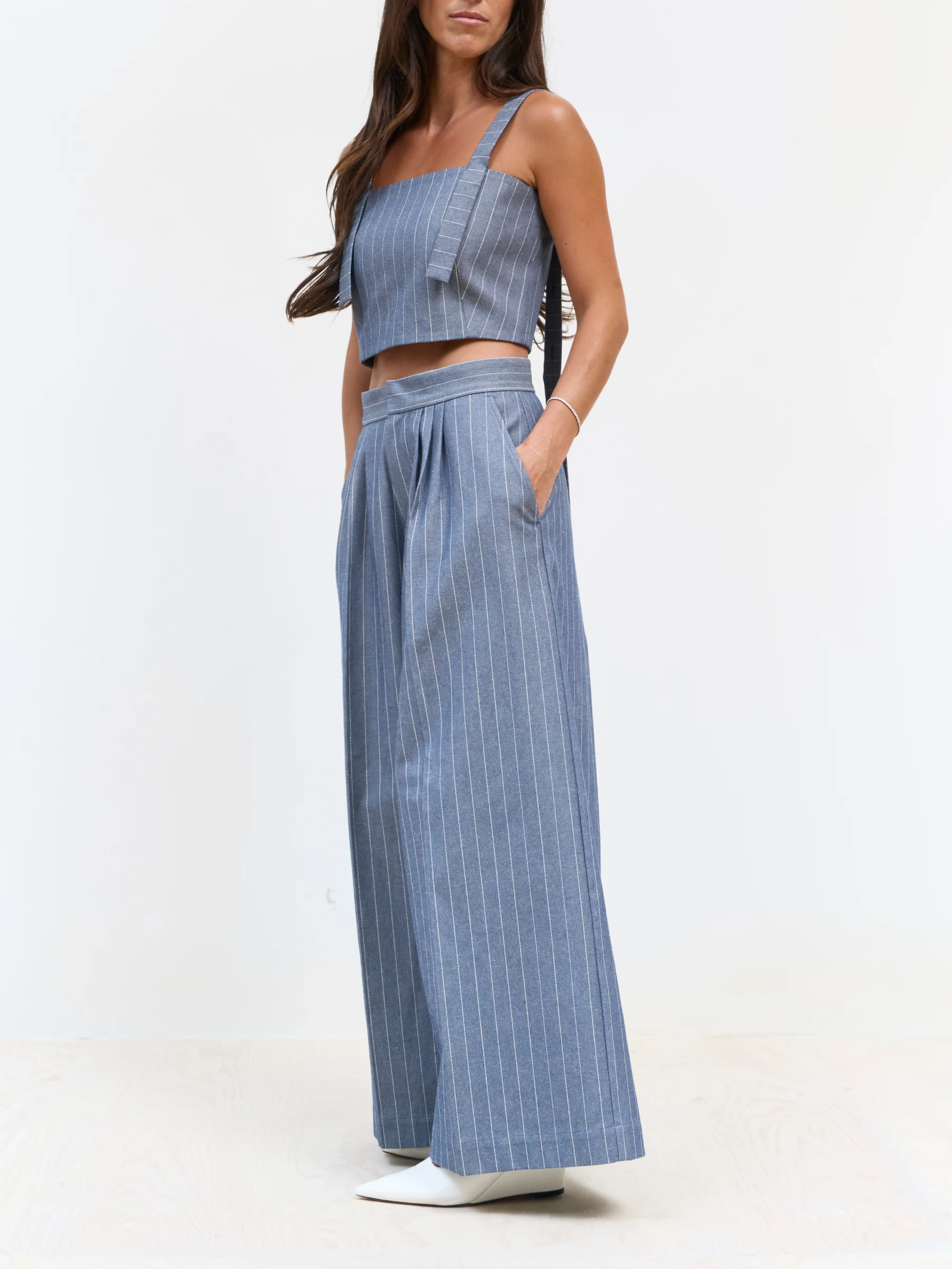 Blue pinstripe pants in Faded Ink, side view