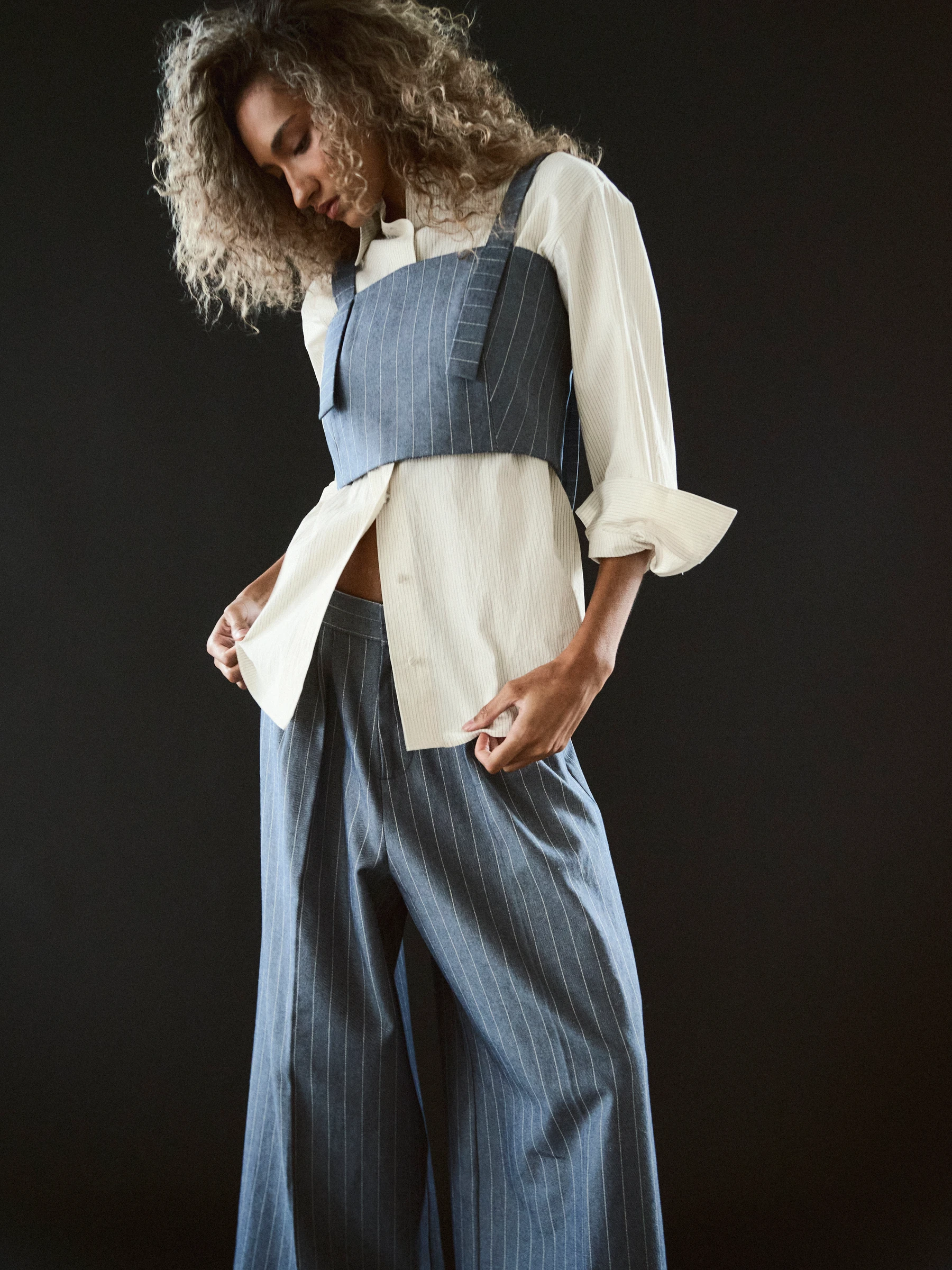 Blue pinstripe pants in Faded Ink, three-quarter view