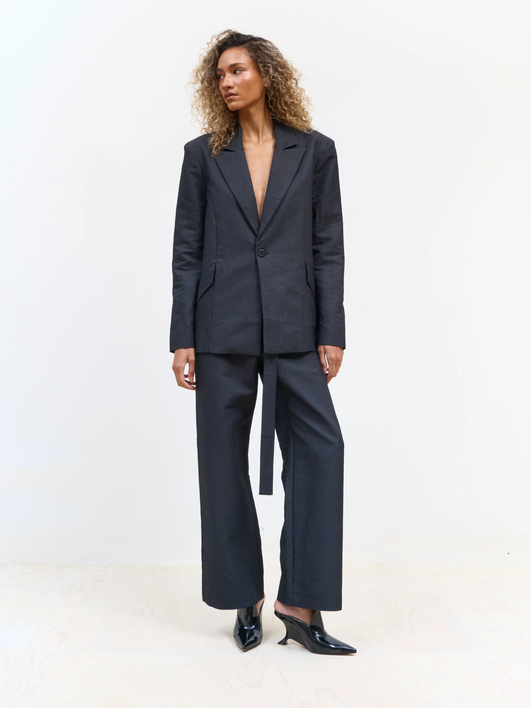 Black backless blazer in 9B, front view