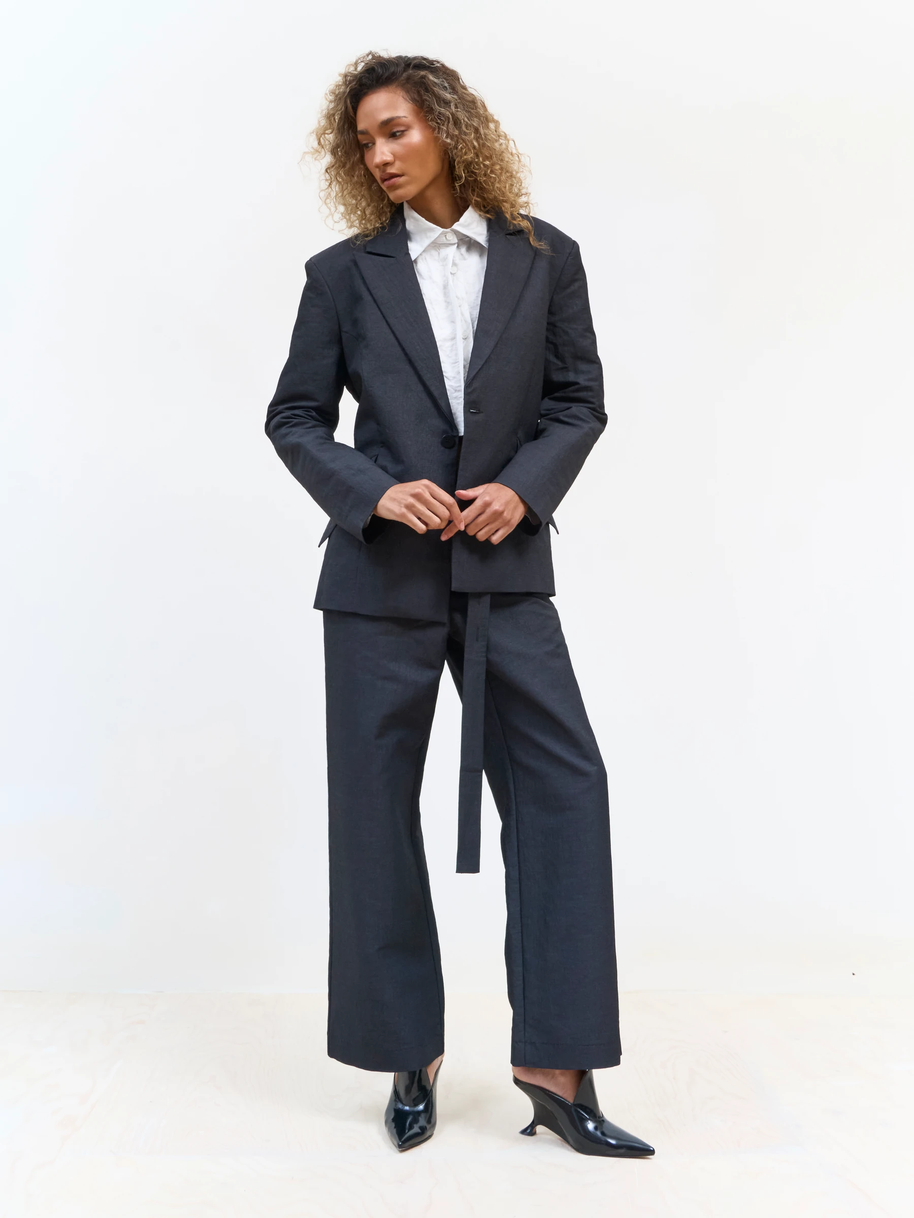 Black backless blazer in 9B, front view