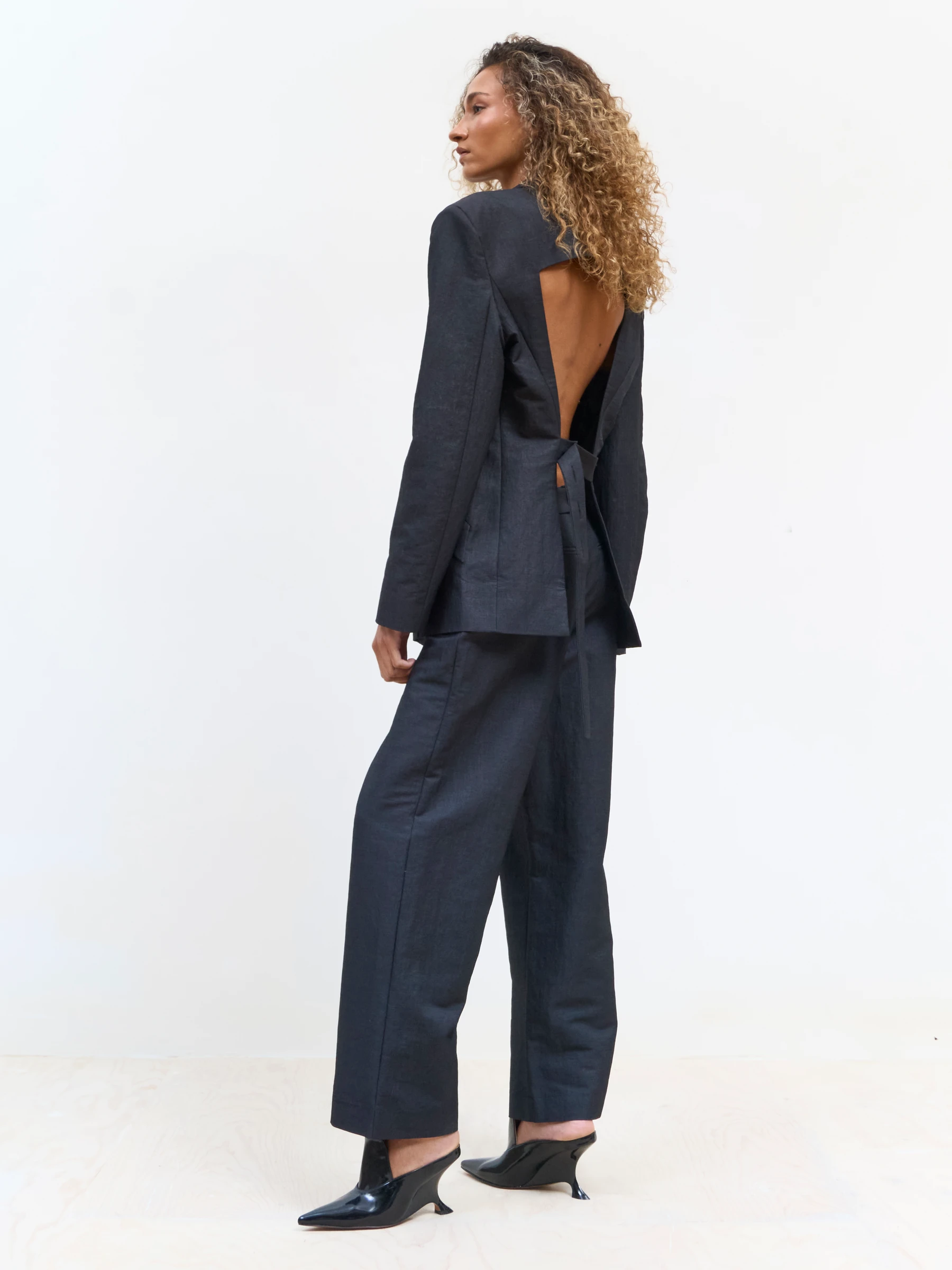 Black backless blazer in 9B, side view