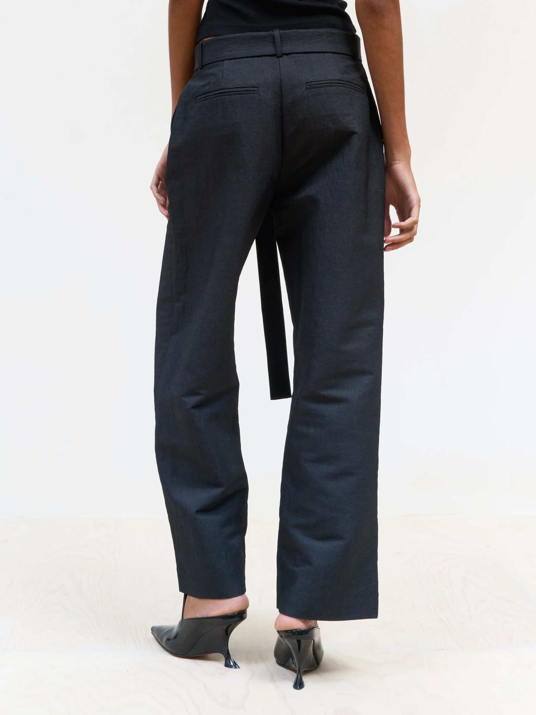 Black wide leg trousers in 9B, back view