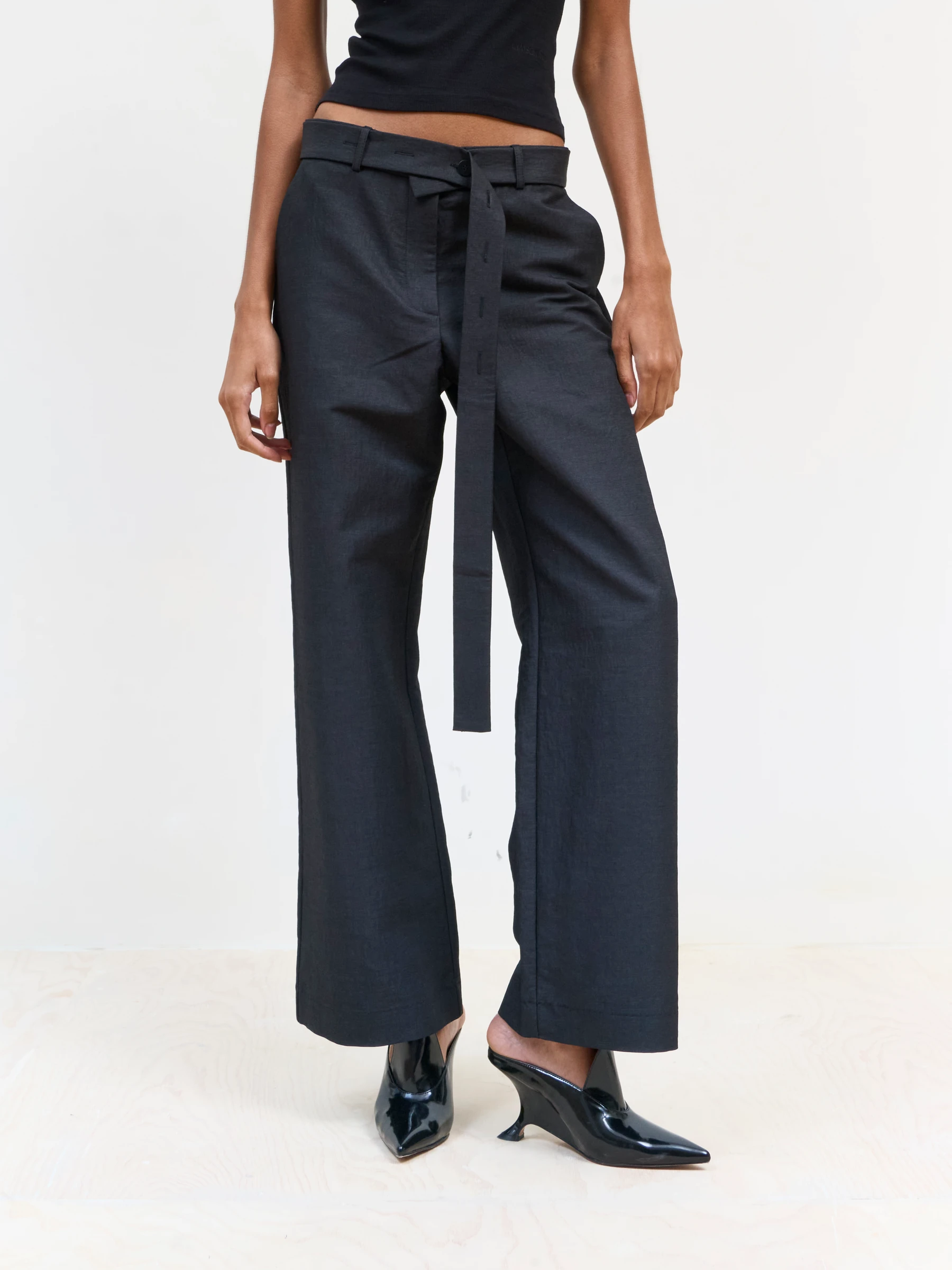 Black wide leg trousers in 9B, front view