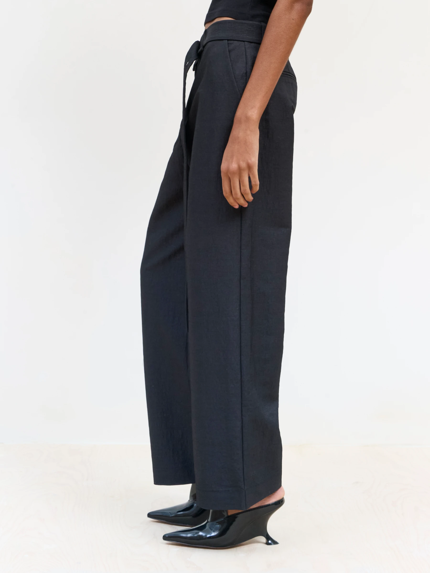 Black wide leg trousers in 9B, side view